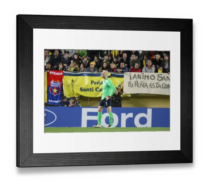Framed Print : Injured Arsenal goalkeeper Manuel Almunal leaves the field