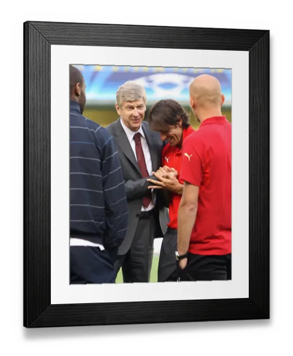 Framed Print : Arsenal manager Arsene Wenger with ex Arsenal player Robert PIres Framed Print : Arsenal manager Arsene Wenger with ex Arsenal player Robert PIres