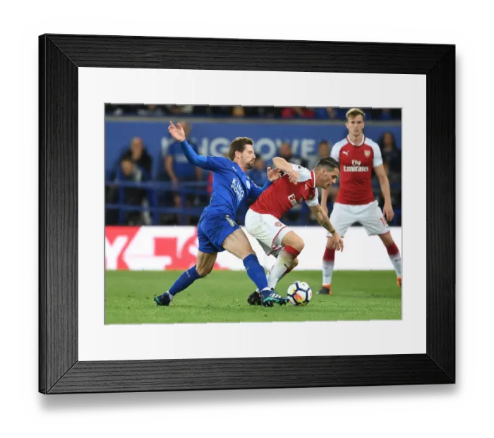 Framed Print : Xhaka vs Silva: A Premier League Battle at The King Power Stadium