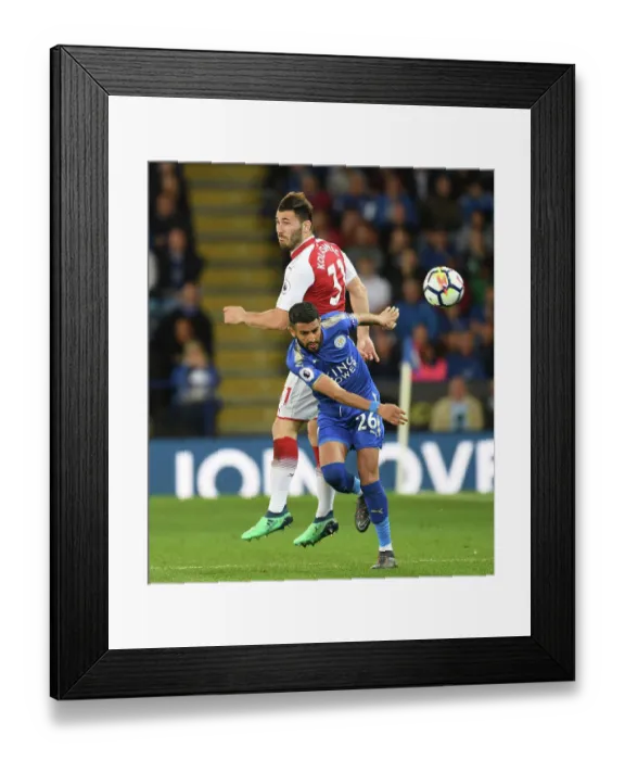 Framed Print : Sead Kolasinac vs Riyad Mahrez: Intense Battle in Leicester City vs Arsenal Premier League Clash