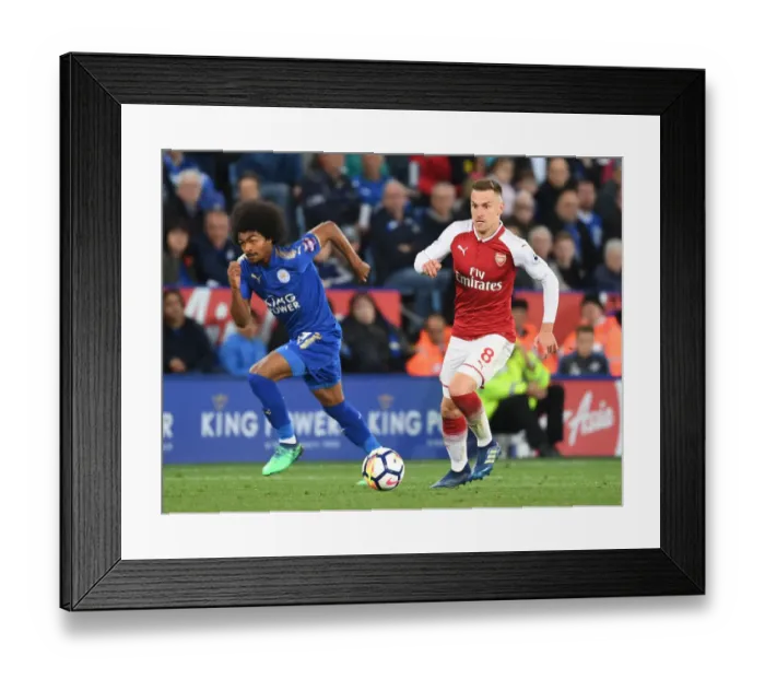 Framed Print : Ramsey Outwits Choudhury: Arsenal's Midfield Maestro Outmaneuvers Leicester's Defender in Premier League Showdown