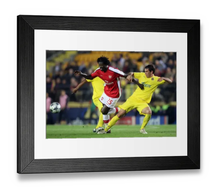 Framed Print : Adebayor vs. Godin: 1st Leg Quarterfinal Showdown in the UEFA Champions League: Arsenal vs. Villarreal (4-7-09)