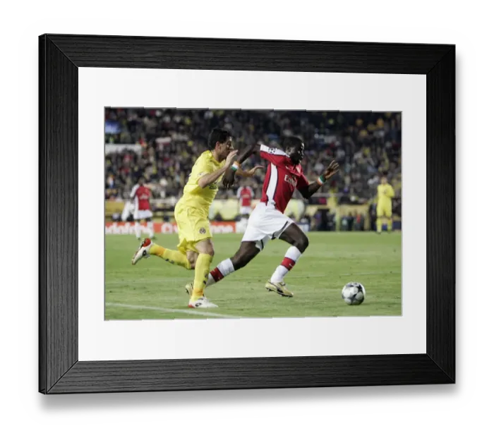 Framed Print : Battle of the Full-backs: Eboue vs. Capdevila in the 2009 UEFA Champions League Quarterfinal Framed Print : Battle of the Full-backs: Eboue vs. Capdevila in the 2009 UEFA Champions League Quarterfinal