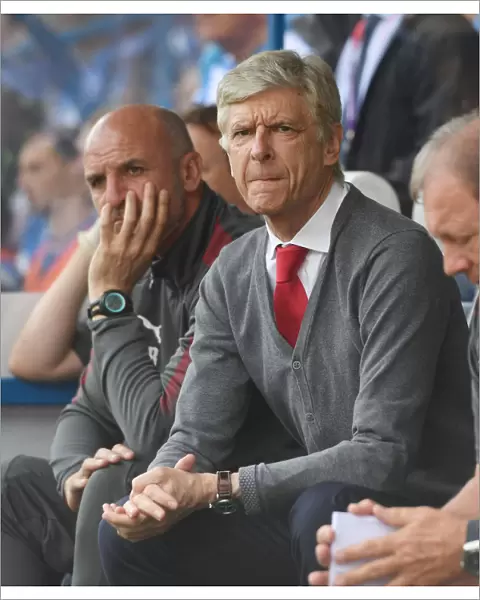 Arsene Wenger and Steve Bould: A Behind-the-Scenes Look at Arsenal's Manager and Assistant during Huddersfield Match