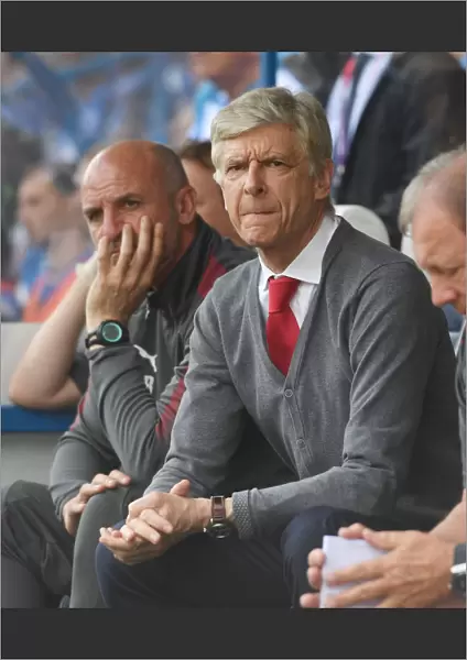 Arsene Wenger and Steve Bould: A Behind-the-Scenes Look at Arsenal's Manager and Assistant during Huddersfield Match