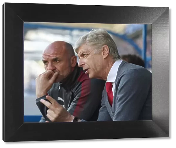Arsene Wenger and Steve Bould: A Farewell Look as Arsenal Secure Premier League Victory over Huddersfield Town