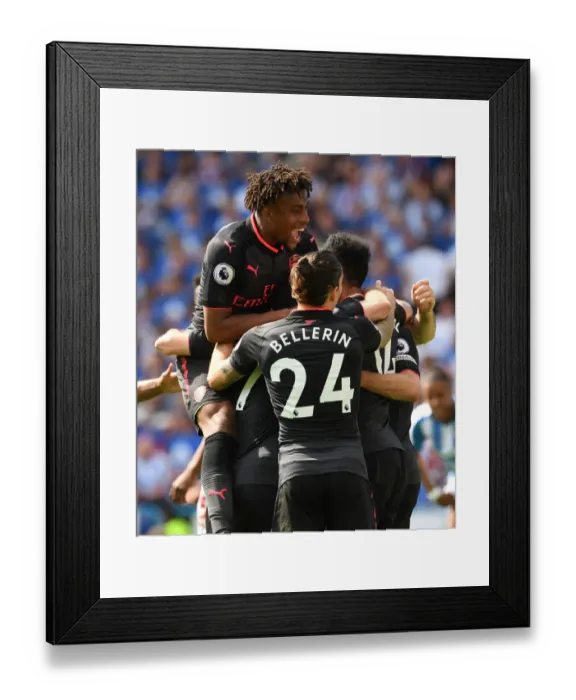 Framed Print : Arsenal's Triumph: Aubameyang, Iwobi, and Bellerin in Unison after Scoring against Huddersfield Town