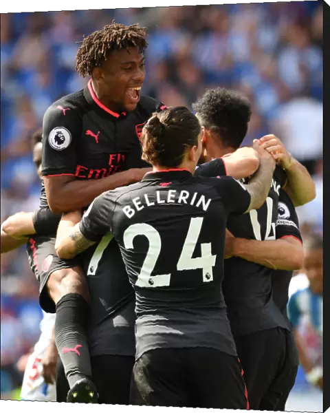 Arsenal's Aubameyang, Iwobi, and Bellerin Celebrate Goal Against Huddersfield Town