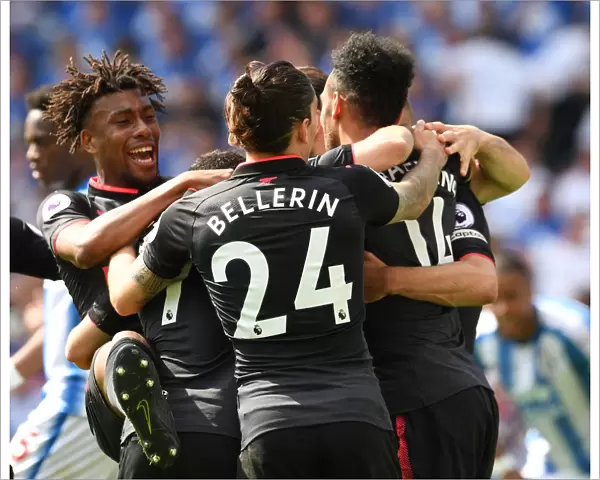 Arsenal's Unforgettable Moment: Aubameyang, Iwobi, and Bellerin Celebrate Goal vs. Huddersfield (2017-18)