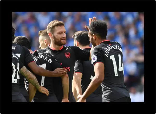 Aubameyang and Mustafi Celebrate Arsenal's Goal Against Huddersfield Town