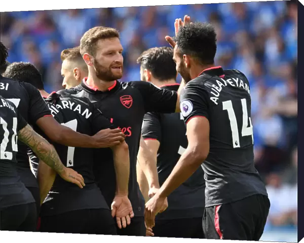 Aubameyang and Mustafi Celebrate Arsenal's Goal Against Huddersfield Town