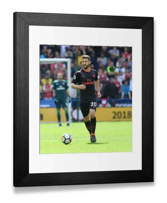 Framed Print : Shkodran Mustafi Focuses in Huddersfield Town vs Arsenal Premier League Clash Framed Print : Shkodran Mustafi Focuses in Huddersfield Town vs Arsenal Premier League Clash