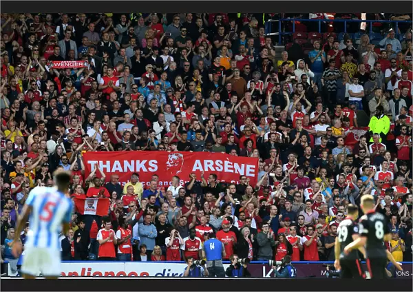 Arsenal Fans Honor Arsene Wenger with Banners at Huddersfield Match
