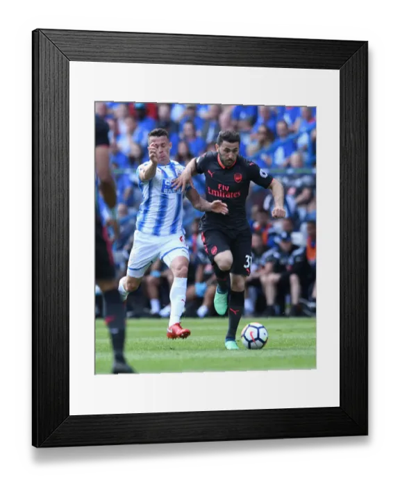 Framed Print : Sead Kolasinac vs. Jonathan Hogg: Intense Battle in Huddersfield Town vs. Arsenal Premier League Clash
