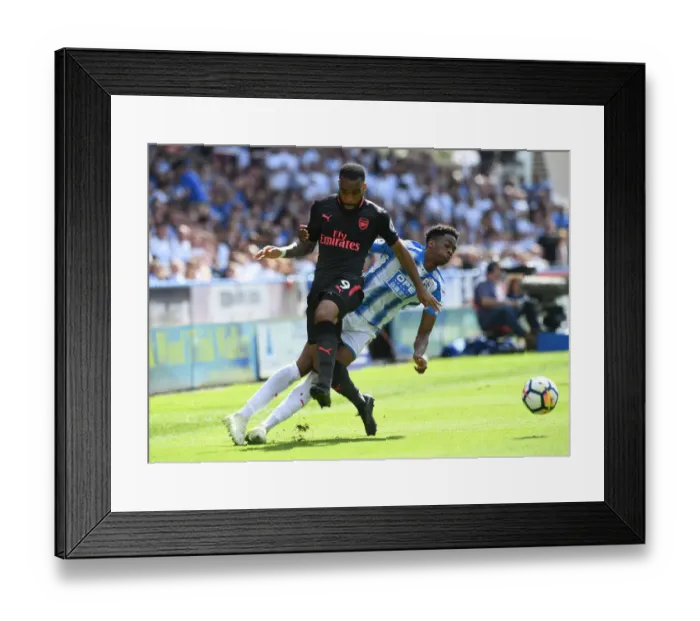 Framed Print : Clash at John Smiths: Lacazette vs. Kongolo in Premier League Showdown Framed Print : Clash at John Smiths: Lacazette vs. Kongolo in Premier League Showdown