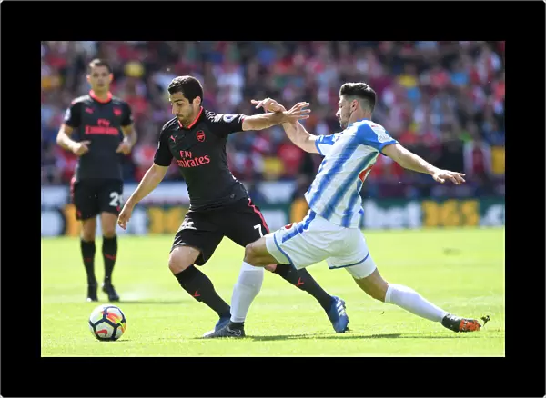Mkhitaryan vs Schindler: Intense Battle in Huddersfield Town vs Arsenal Premier League Clash