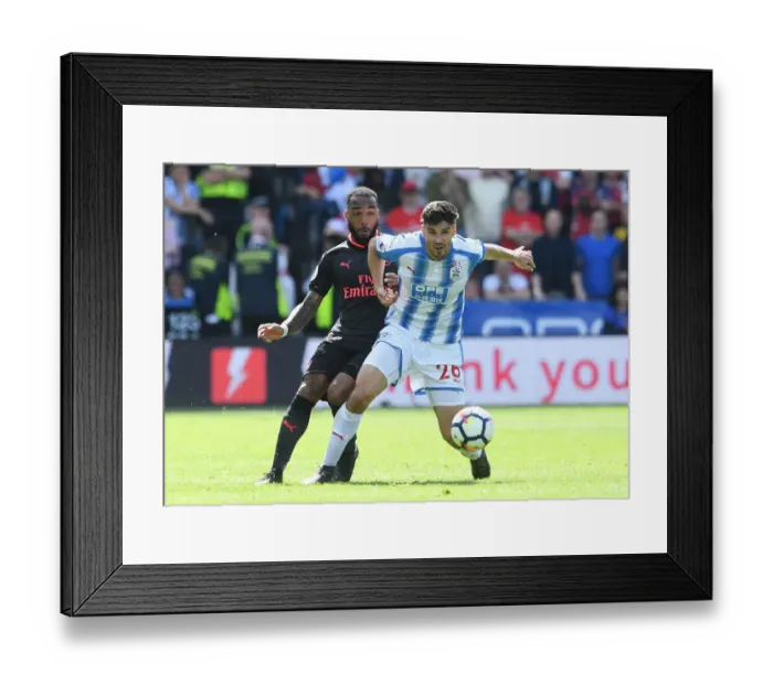 Framed Print : Lacazette vs Schindler: Intense Battle in Huddersfield Town vs Arsenal Premier League Clash Framed Print : Lacazette vs Schindler: Intense Battle in Huddersfield Town vs Arsenal Premier League Clash