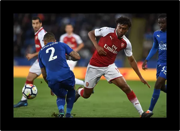 Arsenal's Alex Iwobi Faces Off Against Leicester's Danny Simpson in Premier League Clash