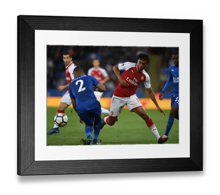 Framed Print : Arsenal's Alex Iwobi Faces Off Against Leicester's Danny Simpson in Premier League Clash