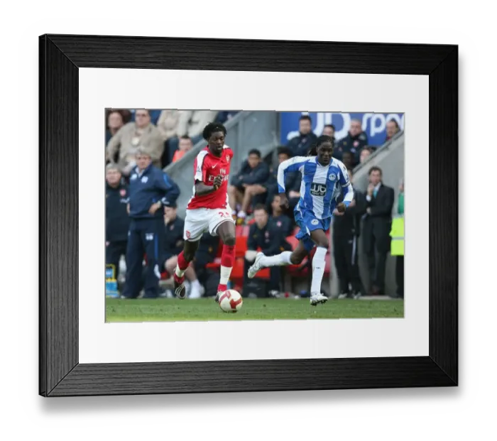 Framed Print : Adebayor's Double: Arsenal Crush Wigan 4-1 in Premier League