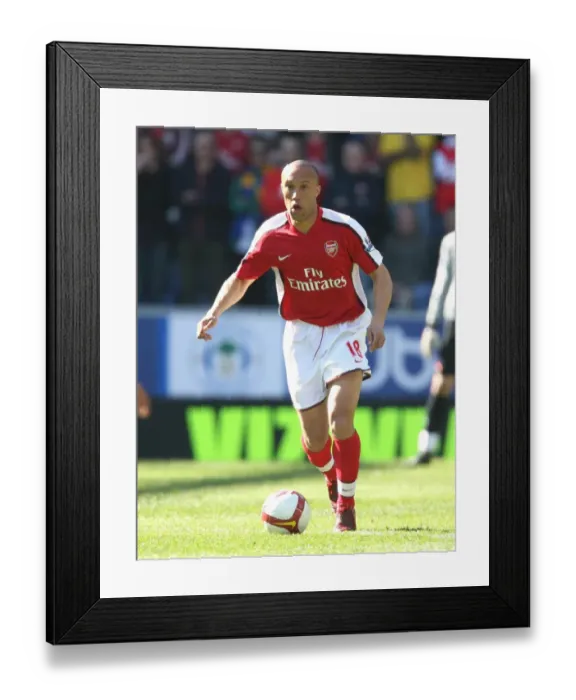 Framed Print : Mikael Silvestre's Dominance: Arsenal Crushes Wigan Athletic 4-1 in Premier League