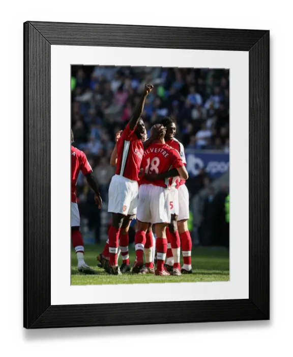Framed Print : Mikael Silvestre, Kolo Toure, and Emmanuel Adebayor: Arsenal's Unstoppable Duo Celebrates Double Strike Against Wigan Athletic (4-1) Framed Print : Mikael Silvestre, Kolo Toure, and Emmanuel Adebayor: Arsenal's Unstoppable Duo Celebrates Double Strike Against Wigan Athletic (4-1)