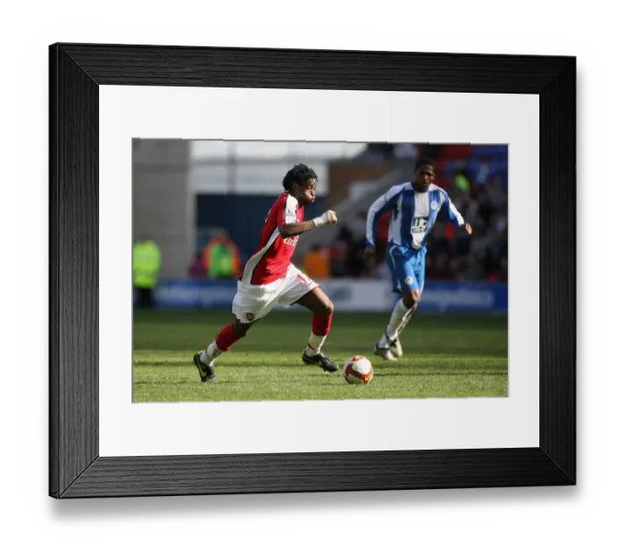 Framed Print : Alex Song's Dominance: Arsenal Crush Wigan Athletic 4-1 in Premier League Framed Print : Alex Song's Dominance: Arsenal Crush Wigan Athletic 4-1 in Premier League