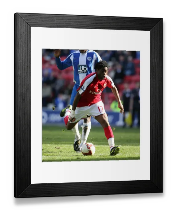 Framed Print : Alex Song's Dominant Performance: Arsenal's 4-1 Victory Over Wigan Athletic Framed Print : Alex Song's Dominant Performance: Arsenal's 4-1 Victory Over Wigan Athletic
