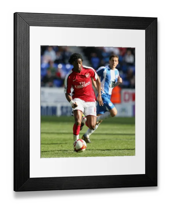 Framed Print : Alex Song's Dominance: Arsenal's 4-1 Victory Over Wigan Athletic in the Premier League
