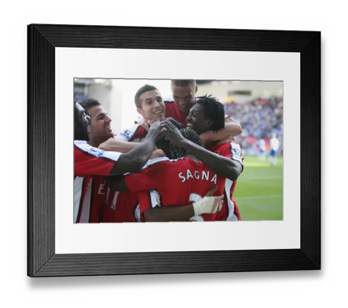 Framed Print : Alex Song celebrates scoring Arsenals 4th goal with his team mates