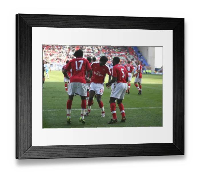 Framed Print : Fourth Goal Celebration: Alex Song, Emmanuel Adebayor, and Kolo Toure, Arsenal's Winning Moment against Wigan Athletic in the Premier League Framed Print : Fourth Goal Celebration: Alex Song, Emmanuel Adebayor, and Kolo Toure, Arsenal's Winning Moment against Wigan Athletic in the Premier League