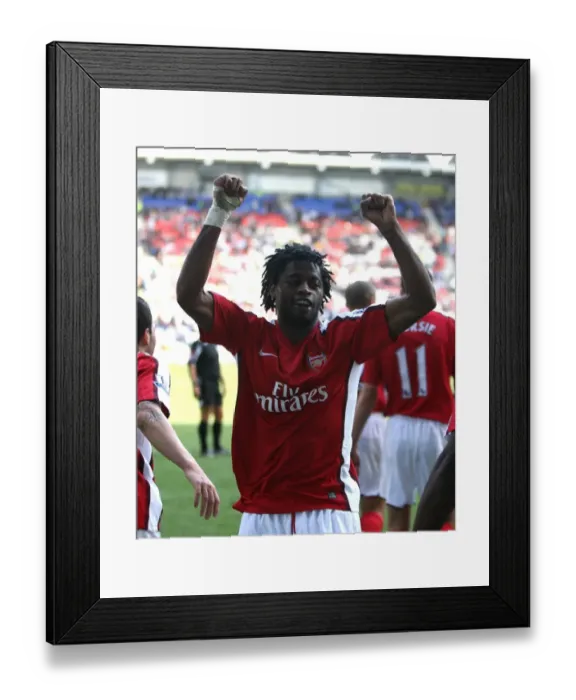 Framed Print : Alex Song's Thrilling Goal Celebration: Arsenal's Game-Changer vs. Wigan Athletic (4-1)