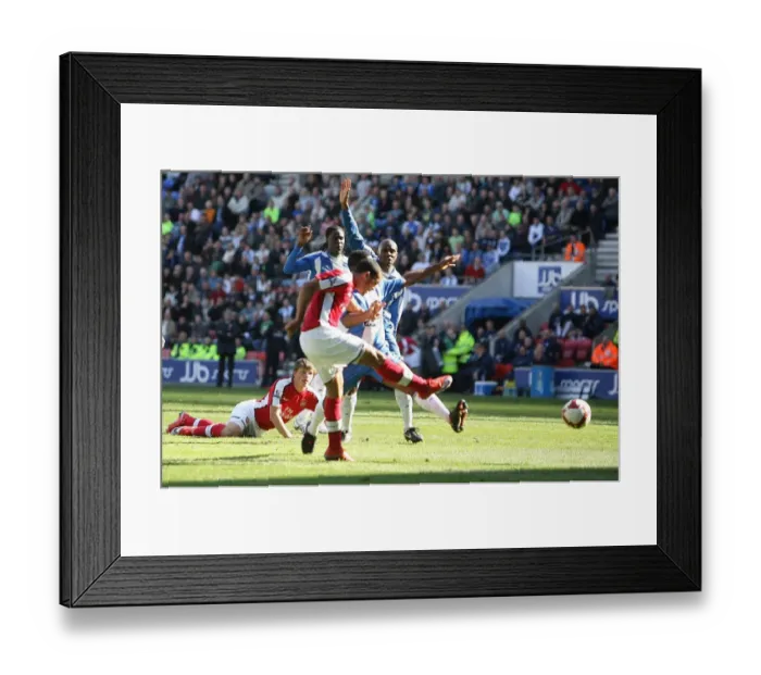 Framed Print : Theo Walcott scores Arsenals 1st goal as Emerson Boyce