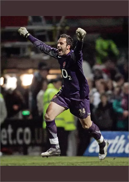 I. Manuel Almunia celebrates winning the penalty shoot out