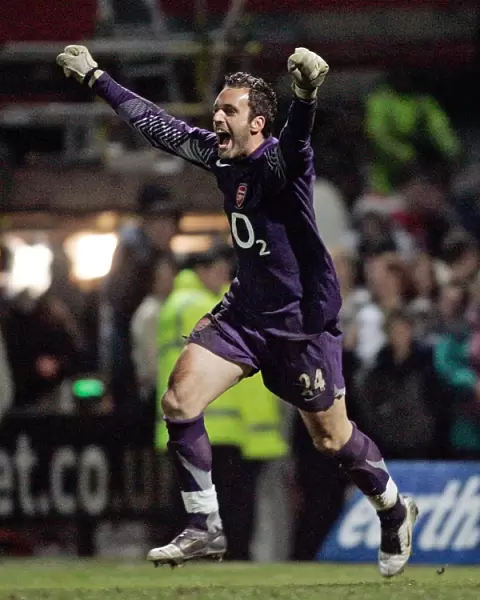 I. Manuel Almunia celebrates winning the penalty shoot out