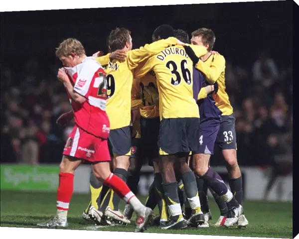 The Arsenal players celebrate winning the penalty shoot out