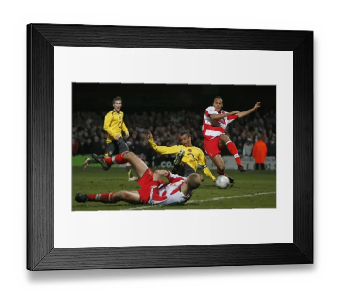 Framed Print : I. Gilberto scores Arsenals 2nd goal under pressure from Sam Oji (Doncaster)