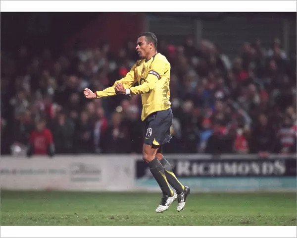Gilberto celebrates scoring for Arsenal during the penalty shoot out