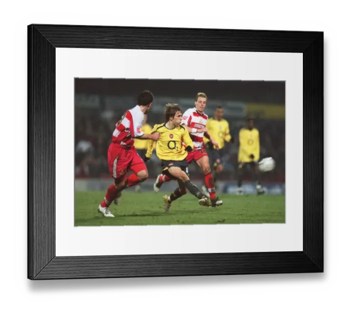 Framed Print : Arturo Lupoli (Arsenal) Ricky Ravenhill (Doncaster)