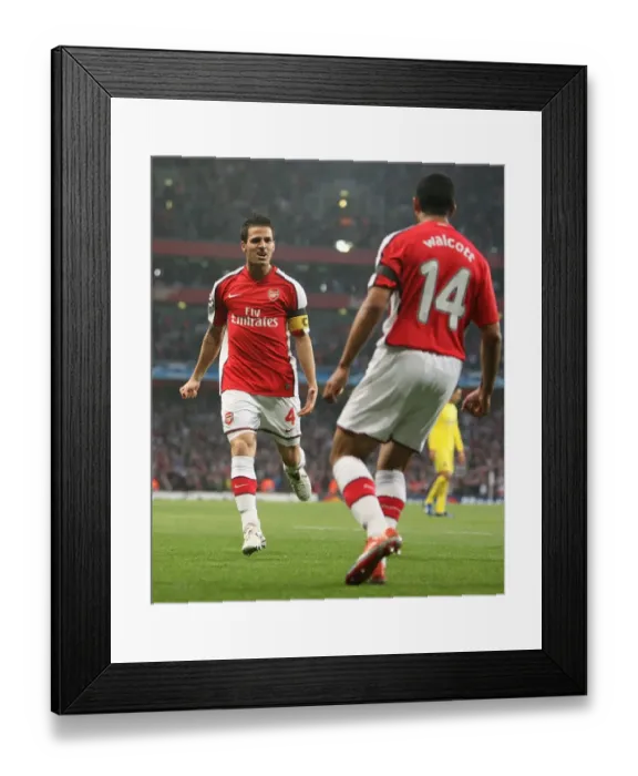 Framed Print : Unforgettable Moment: Fabregas and Walcott's Euphoric Goal Celebration in Arsenal's 3:0 UEFA Champions League Victory over Villarreal Framed Print : Unforgettable Moment: Fabregas and Walcott's Euphoric Goal Celebration in Arsenal's 3:0 UEFA Champions League Victory over Villarreal
