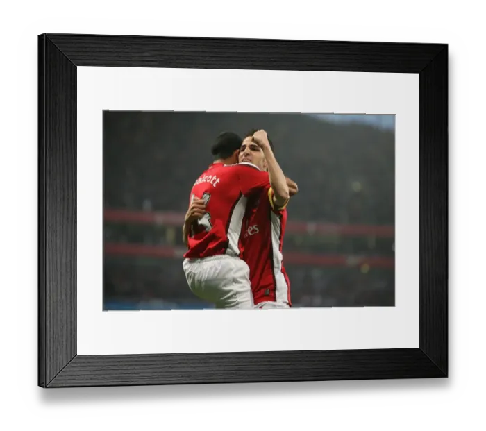 Framed Print : Unforgettable Arsenal: Fabregas and Walcott's Euphoric Goal Celebration - Arsenal's 3:0 UEFA Champions League Victory over Villarreal