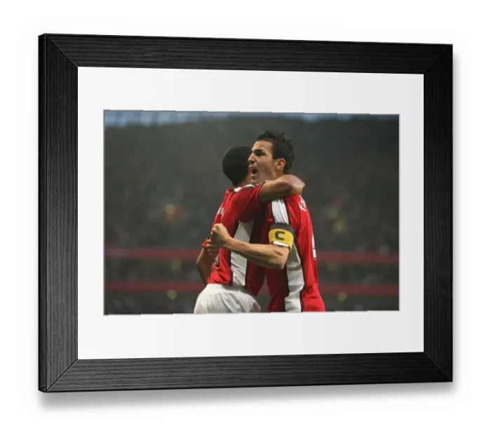 Framed Print : Fabregas and Walcott's Euphoric Goal Celebration: Arsenal's Unforgettable 3:0 UEFA Champions League Victory over Villarreal