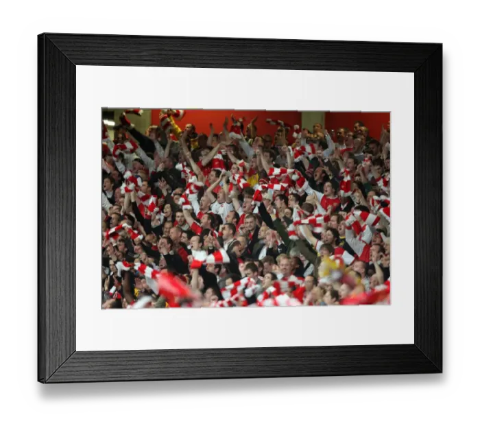 Framed Print : Arsenal fans celebrate the 3rd goal