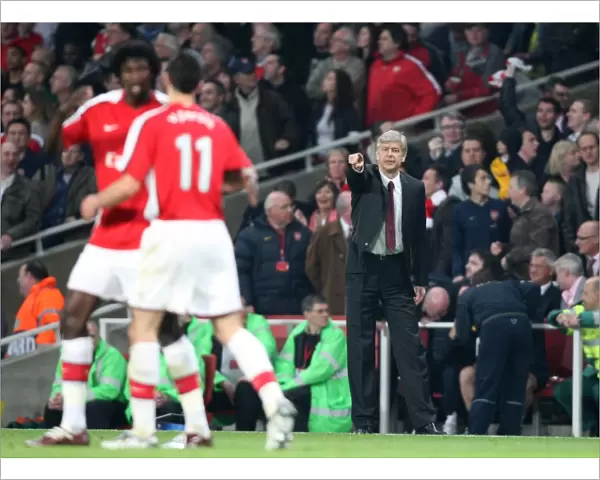Arsene Wenger the Arsenal Manager passes on some instructions
