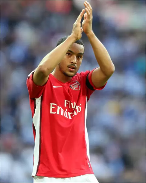Theo Walcott (Arsenal) claps the fans after the match