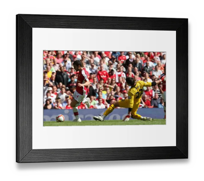 Framed Print : Cesc Fabregas rounds Brad Jones