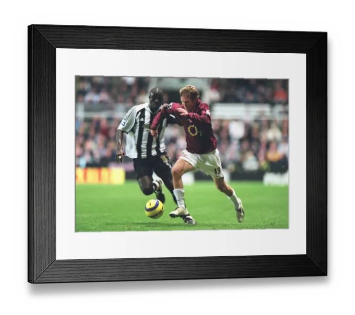 Framed Print : Hleb vs. Faye: Newcastle United's 1-0 Victory Over Arsenal at St. James Park (10 / 12 / 2005) Framed Print : Hleb vs. Faye: Newcastle United's 1-0 Victory Over Arsenal at St. James Park (10 / 12 / 2005)
