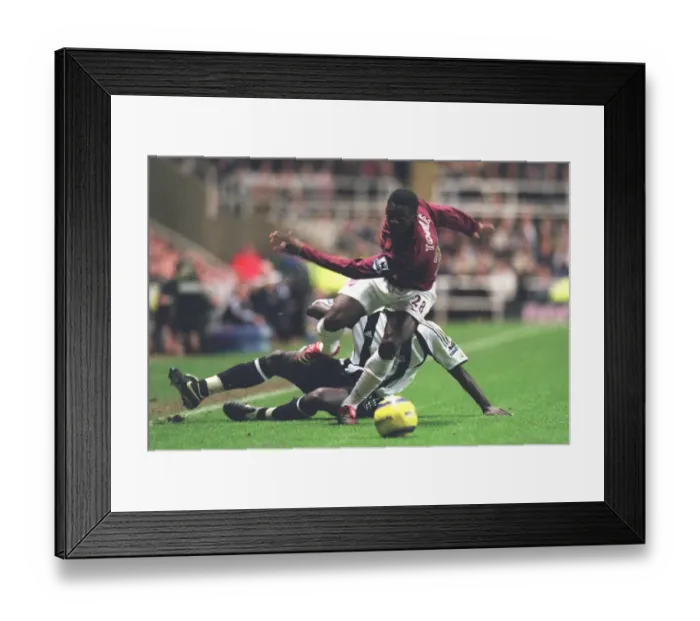 Framed Print : Kolo Toure vs. Amdy Faye: Newcastle United's Shock 1-0 Victory Over Arsenal at St. James Park (2005) Framed Print : Kolo Toure vs. Amdy Faye: Newcastle United's Shock 1-0 Victory Over Arsenal at St. James Park (2005)
