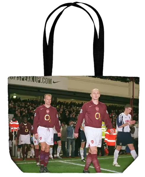 Dennis Bergkamp and Pascal Cygan (Arsenal) walk out onto the pitch