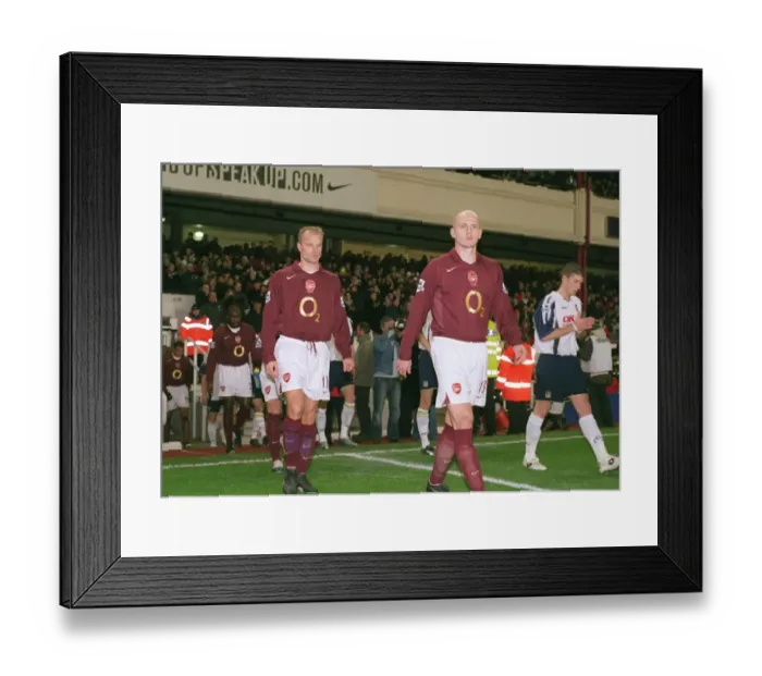 Framed Print : Dennis Bergkamp and Pascal Cygan (Arsenal) walk out onto the pitch Framed Print : Dennis Bergkamp and Pascal Cygan (Arsenal) walk out onto the pitch